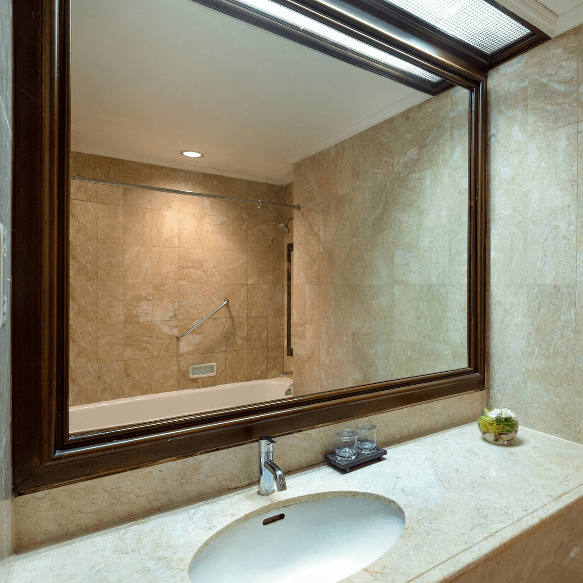 Bathroom interior in deluxe room of Hotel Ciputra